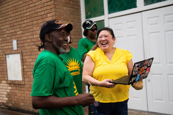 Grace Tee Lewis (R) shares a laugh with friend and partner Pastor Henry Price (L) from Sunnyside Community Redevelopment Organization (SCRO).