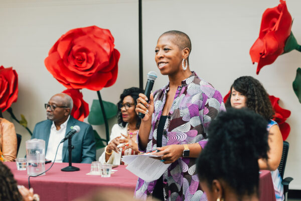Dr. Ticora Jones welcomes attendees of the last panel on climate justice research.